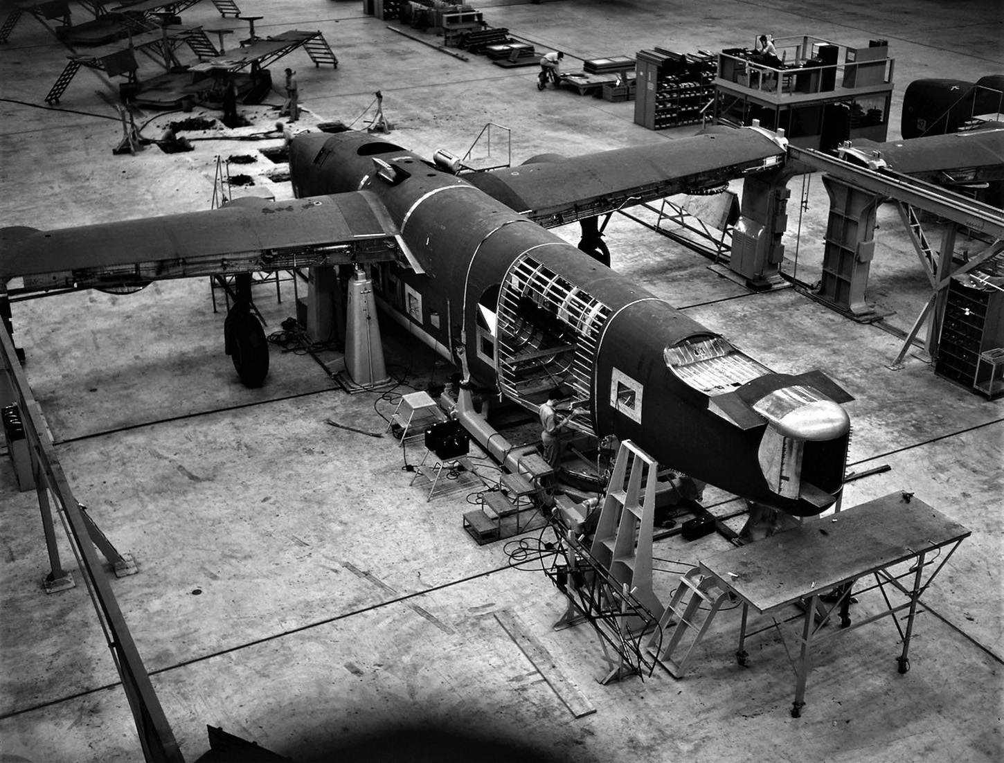 A C-87 transport aircraft, a modification of the Liberator design, sits on the  Consolidated Aircraft factory floor in Fort Worth, Texas, in 1942.