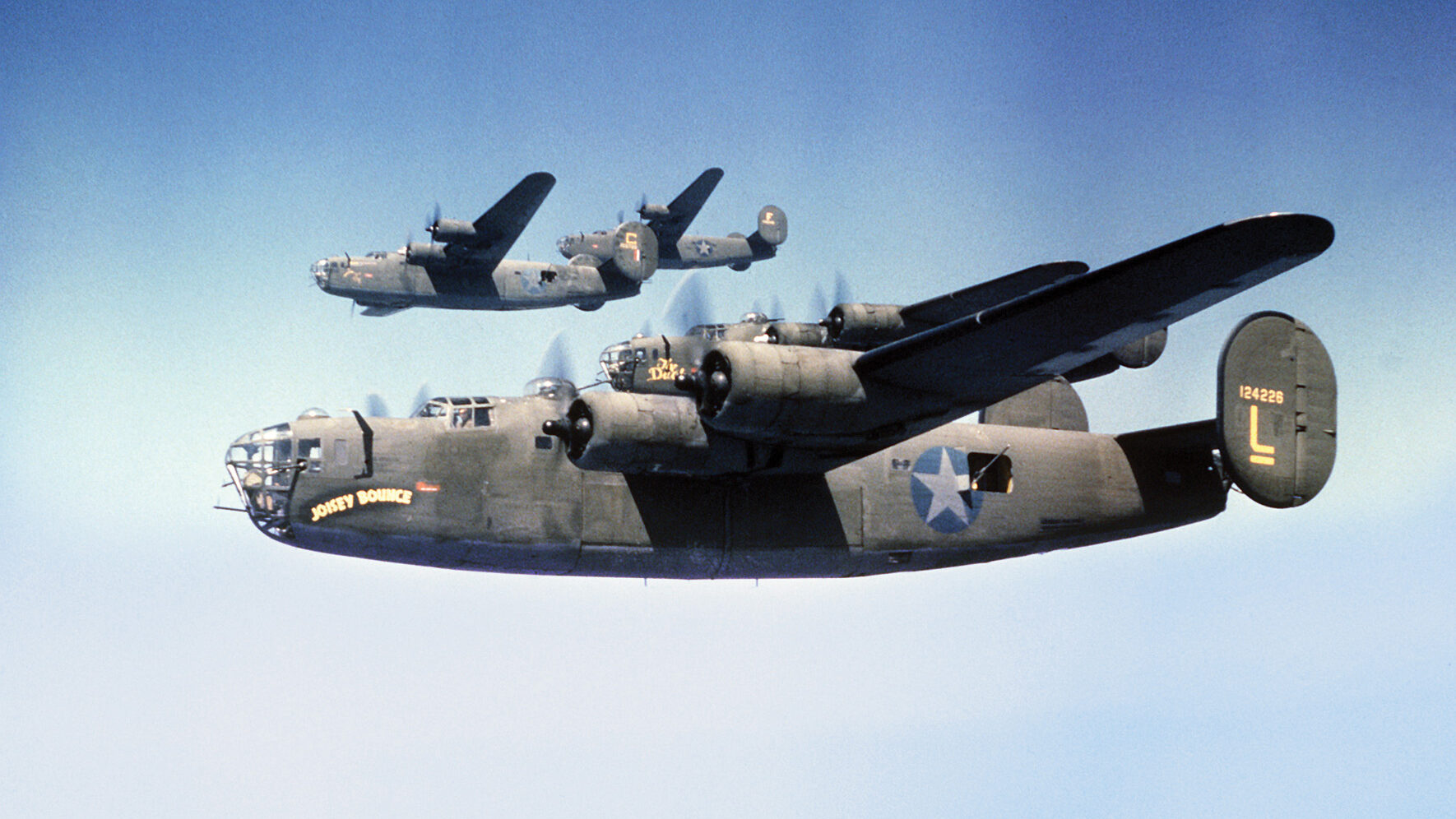 A formation of Consolidated B-24 Liberator bombers flies toward a target.  The B-24 rendered tremendous and versatile service to the Allies in World War II. 