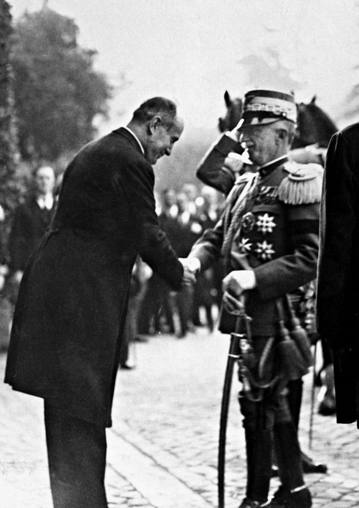 Mussolini bows before King Victor Emmanuel III after leaving the Church of St. Maria degli Angeli in Rome. This photo was taken in 1927, when Il Duce was popular among the Italian people.