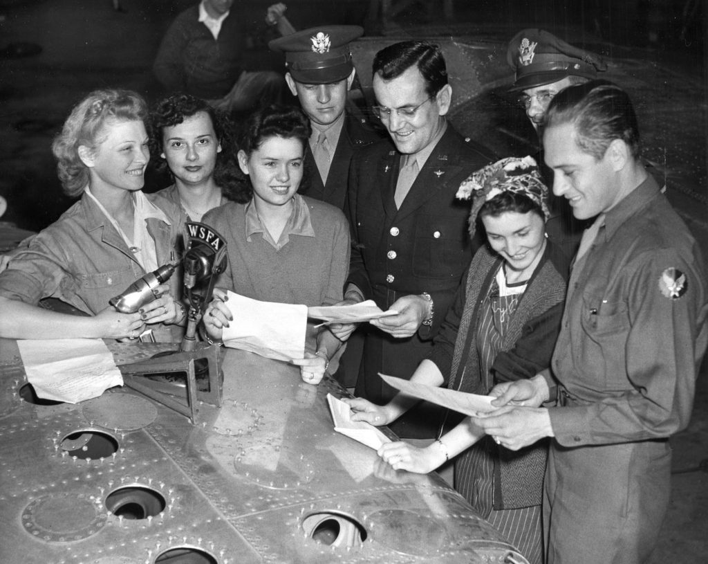 Fans meet the famed Glenn Miller and gather around a radio broadcast area prior to one  of the bandleader’s shows. Miller’s small plane disappeared over the English Channel in December 1944,  and the circumstances of his death remain a mystery.