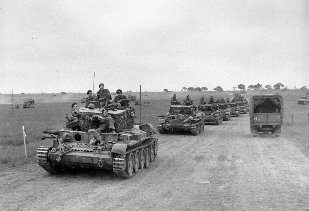 Rearmed and refueld, a long line of British Cromwell tanks prepare to move out along a dirt road near Caen. Stubborn German resistance at Caen prevented the British from taking the city until July 20, by which time the crossroads city had lost its strategic value.
