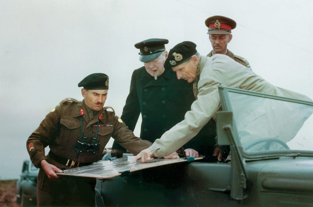 Field Marshal Bernard L. Montgomery, commander of Allied ground forces in Normandy, confers with Prime Minister Winston S. Churchill and army commanders Lt. Gen. Guy Simonds (left) and Lt. Gen. Miles Dempsey.