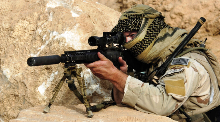 A U.S. Navy SEAL trains on a MK-12 special purpose rifle, one of the four sniper rifles that Kyle used, which is similar to an M-16 but with a shorter barrel. Kyle often carried an MK-12 while clearing buildings in Iraq’s most dangerous cities.