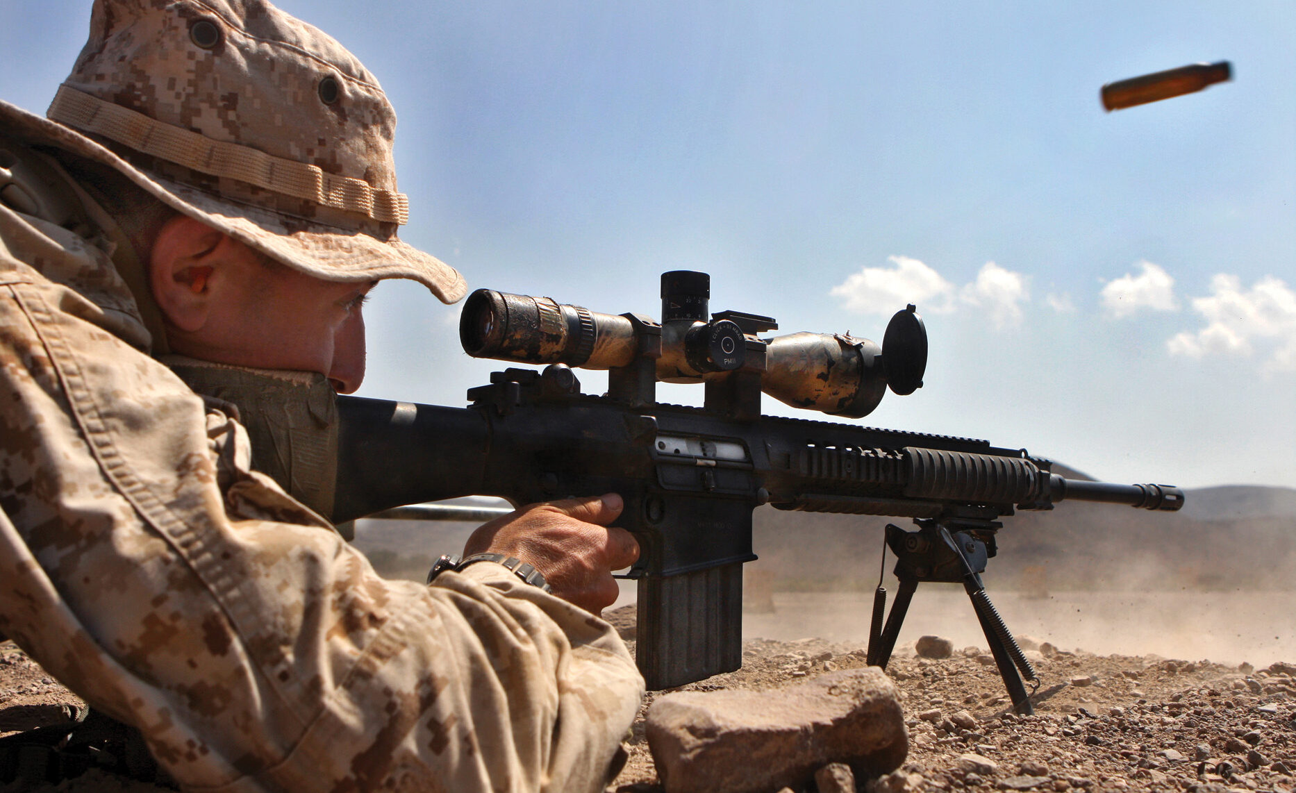 A Marine fires an MK-11. Kyle found the MK-11 to be a highly versatile weapon since it could be outfitted with a variety of different optics and suppressors. 