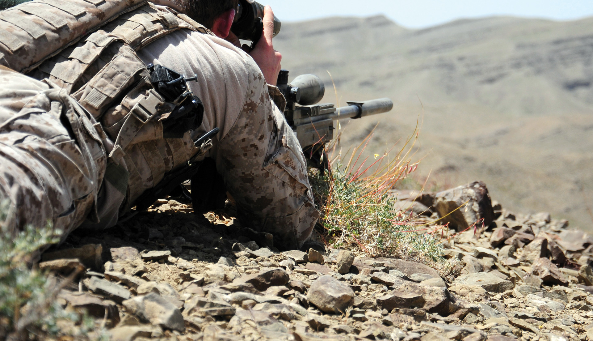 A Navy SEAL sniper uses a MK.13 Mod 5 sniper rifle while on an operation in Zabul province, Afghanistan. 