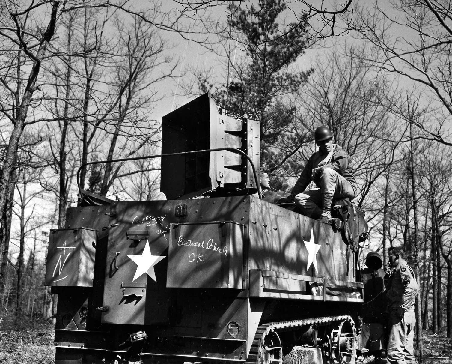 The U.S. Army used recordings to fool the enemy into thinking that vehicle movements or skirmishes were taking place. Here a giant loudspeaker on a halftrack at Fort Knox, Kentucky, tests the fidelity of the sound effects. 