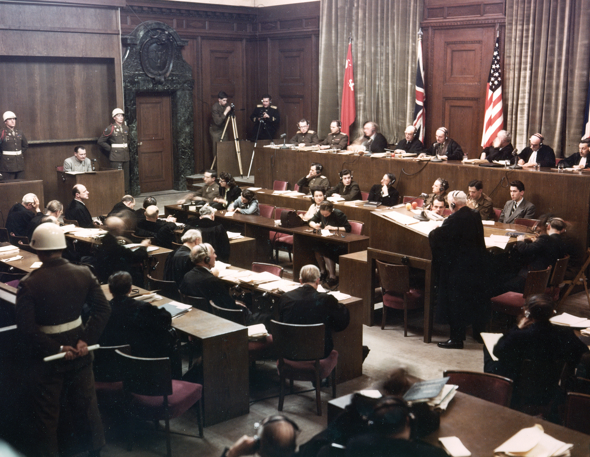 Hermann Göring (left), former head of the German air force and high Nazi government official, is questioned by a lawyer as judges from four victorious Allied nations listen to the testimony.