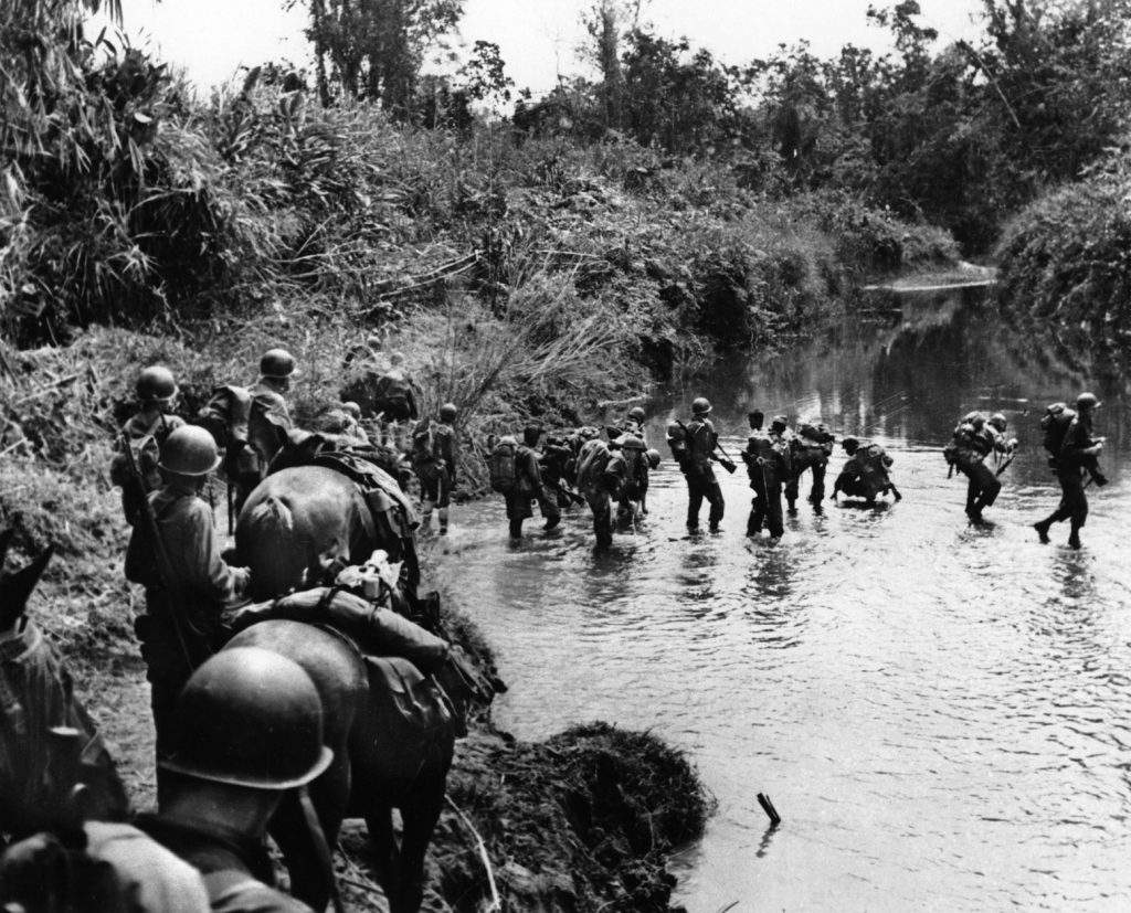 American troops of the famed Marrill's Marauders cross a stream in the Hukawng Valley of Burma during the Allied offensive against Myitkyina. The Marauders became famous for their combat prowess, and also for their endurance during extensive periods campaigning in the deep jungle. 