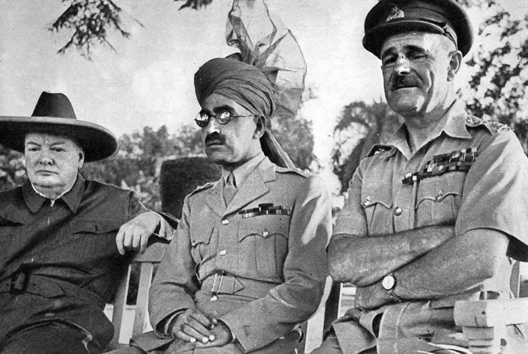 Wavell stands at right along with Winston Churchill (left) and Sir Sikander Hyat Khan (center), an Indian military officer and political figure. Wavell was reassigned to the CBI after Churchill relieved him from command in North Africa.
