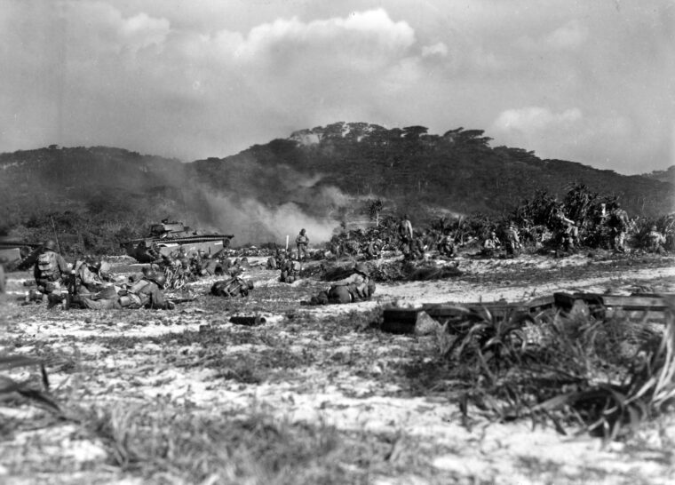 Troops of the U.S. Army’s 306th Regimental Combat Team, 77th Infantry Division, come ashore at tiny Geruma Shima, one of the Kerama Retto group of islands near Okinawa, during Operation Iceberg, March 26, 1945.