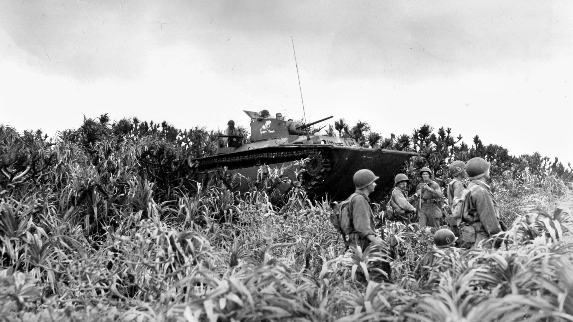 Amtracks cross Keise Shima supported by infantry of the 77th Division. Twenty-four 155mm artillery pieces of the 420th Field Artillery Group were brought ashore the tiny island and aimed at Okinawa only eight miles away.