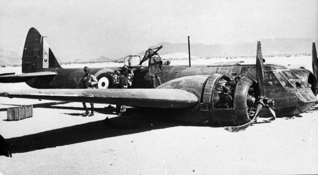 Damaged and inoperable, a Royal Air Force Bristol Blenheim light bomber lies at an airfield at Berbera, Somaliland, in August 1940. 