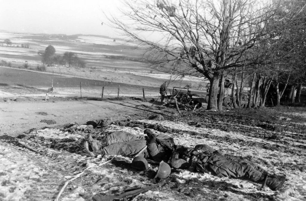 The fighting at Chaumont took a heavy toll in American lives. Here, two slain GIs lie in a snowy field. 