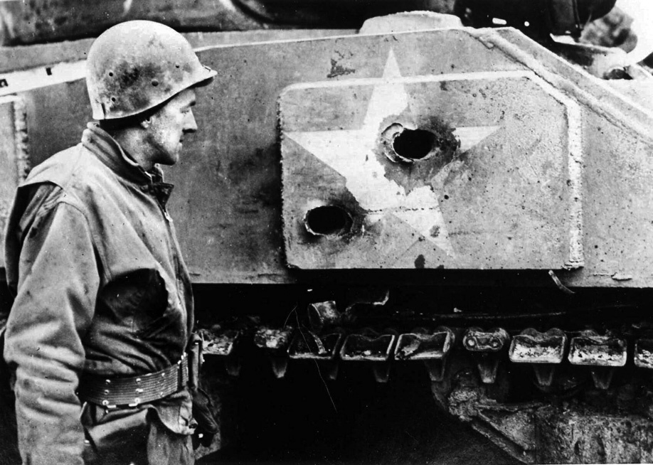 A 4th Armored tank destroyed outside Bastogne. Both hits struck on the white identification star on the M4’s hull, which German gunners used as an aiming point. Even the add-on armor plate did not save this tank from high-velocity German gunfire. 