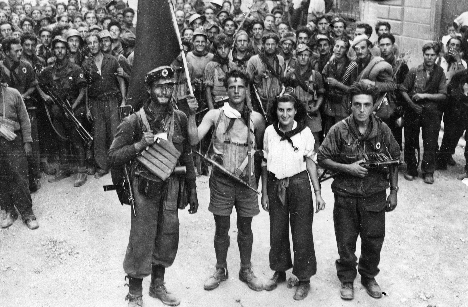 Photographed after the liberation of the city of Florence, these Italian partisans appear to be members of the National Liberation Committee, a group that included diverse political organizations.