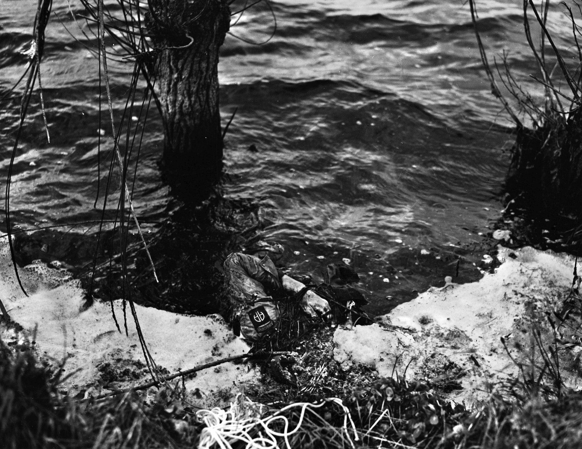 This paratrooper of the 82nd Airborne Division was one of many who lost their lives in the opening moments of the airborne invasion of Normandy. The Germans had flooded low-lying areas, and some men drowned upon landing as they were unable to negotiate high water while wearing heavy packs.