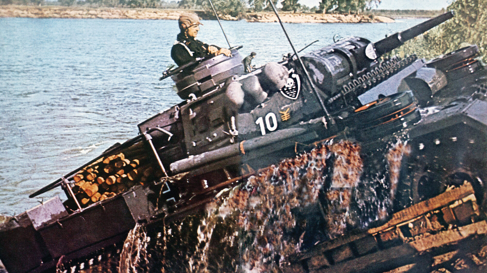 A PzKpfw. III command tank churns through the water of a river somewhere in Russia during Operation Barbarossa. The command tank, or panzerbefehlswagen, of this type was fielded by the 6th and 18th Panzer Regiments during Barbarossa.