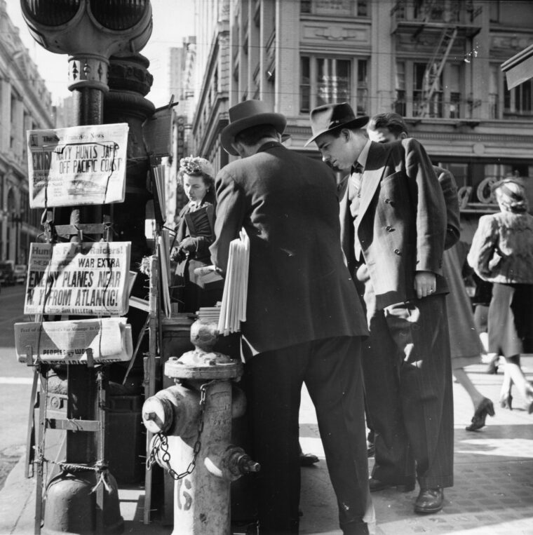 San Francisco residents snap up the latest editions of the city’s newspapers and try to separate fact from rumor amid a swirl of information related to enemy activity in the early days of the war. The Japanese made numerous attempts to bring the war home to the U.S. West Coast, including submarines surfacing off the coast to shell targets or attempting to launch attack aircraft.