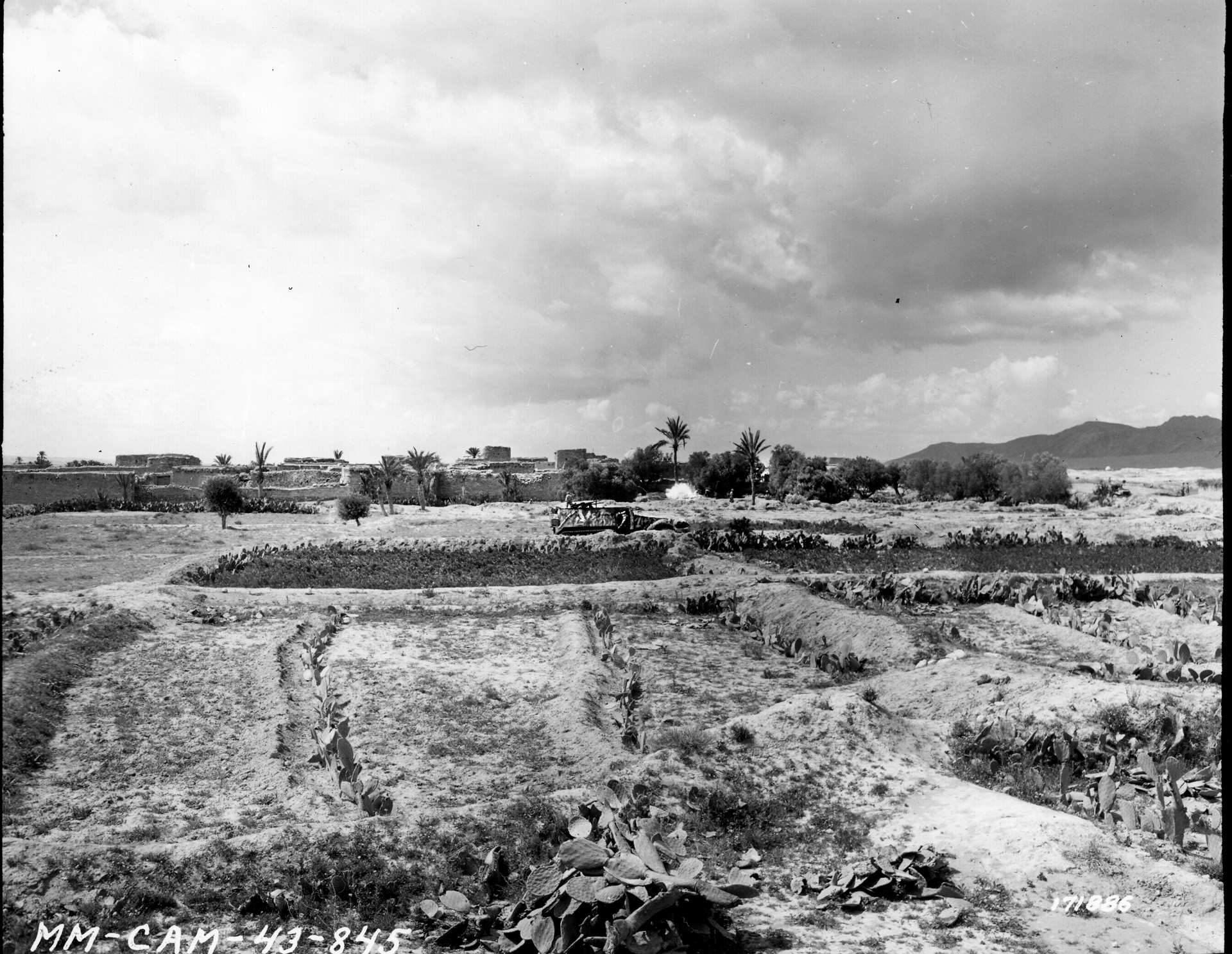 An M3 Halftrack rolls past El Guettar before the battle. Terry Allen successfully defended the town while Patton provided him with desperately needed supplies and armor. 