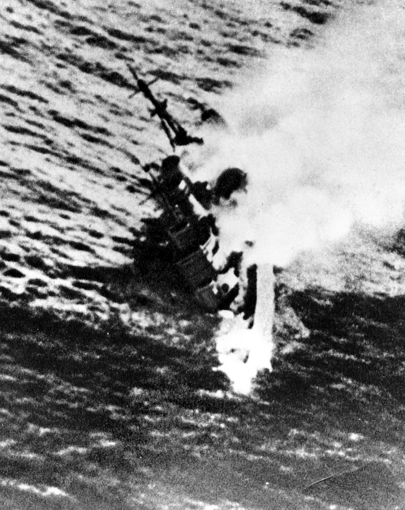 Smoke billows from the stricken heavy cruiser Exeter after an attack by Japanese forces in the Java Sea in March 1942.  Exeter had sustained damage in earlier fighting and failed to reach safety in the harbor of Colombo, Ceylon. 