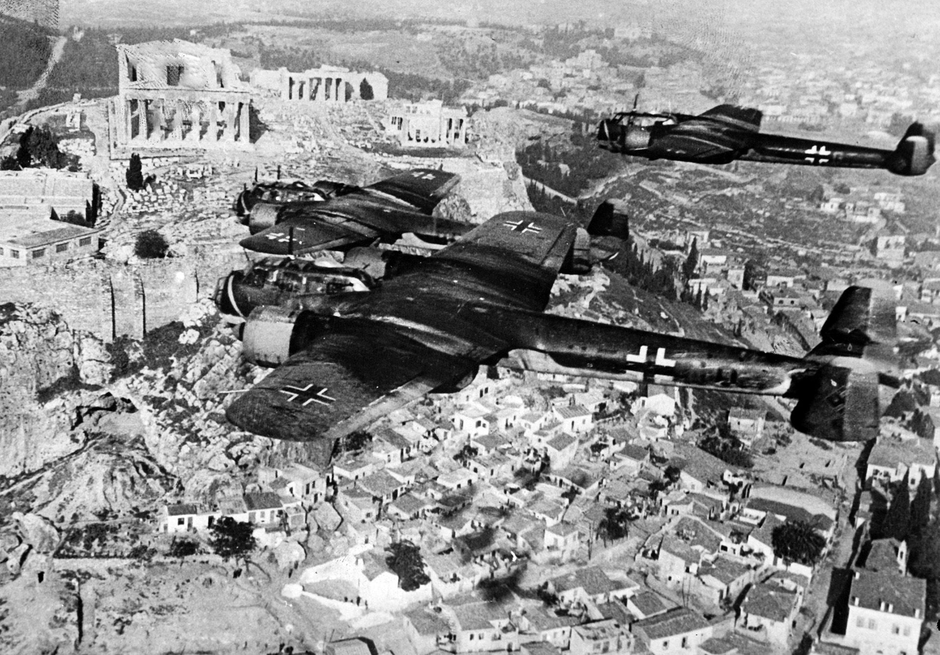 In this 1941 photograph, a flight of Luftwaffe twin-engine Dornier Do-17 bombers flies above the Acropolis in Athens, Greece. The German armed forces were dispatched to Greece initially to salvage a deteriorating situation caused by the ill-advised Fascist Italian invasion of the country.
