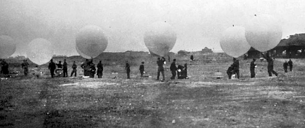 Near the coastline at Felixstowe, Suffolk, military personnel prepare to launch weather balloons carrying bombs. The prevailing winds were expected to take the lethal airborne packages over the Third Reich. 