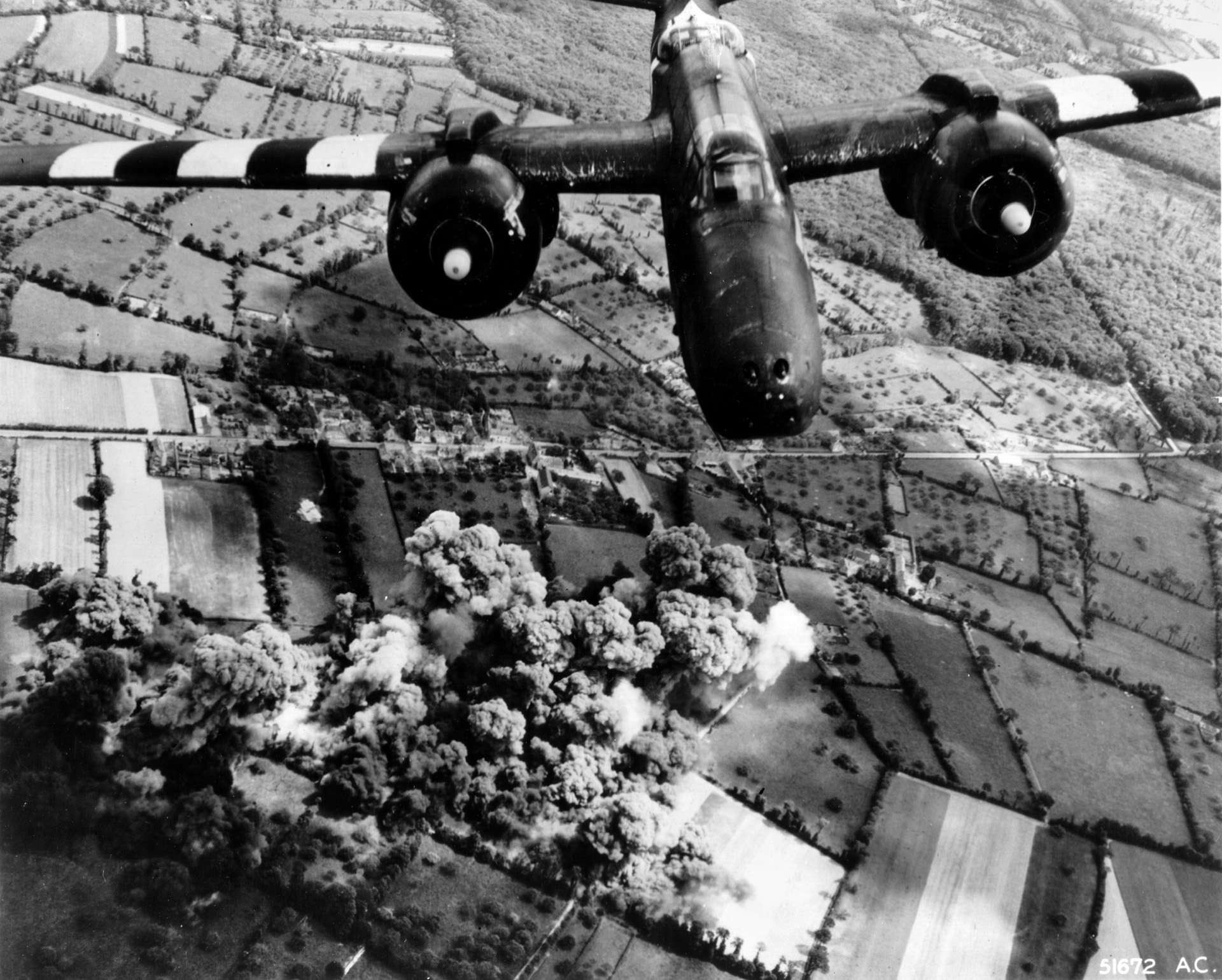 Douglas A-20 Havoc bombers complete their runs against the headquarters of General Dietrich Krauss, commander of the German 352nd Infantry Division in France on June 7, 1944, the day after the Allied landings in Normandy.