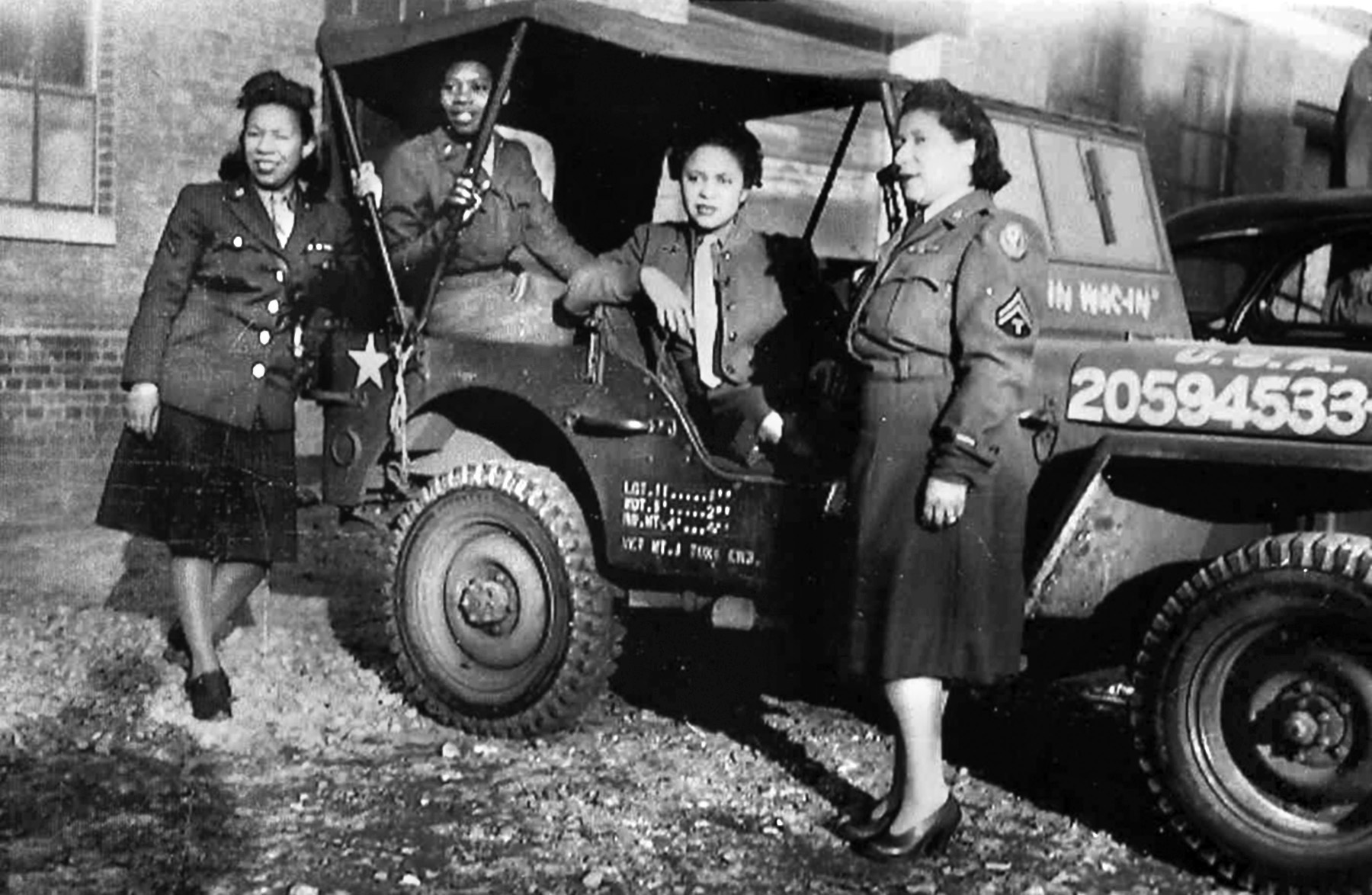 Four members of the 6888th prepare to head out in a jeep. Johnson, who grew up driving her family car, drove vehicles at Camp Breckenridge, Kentucky, where she worked in the motor pool. 