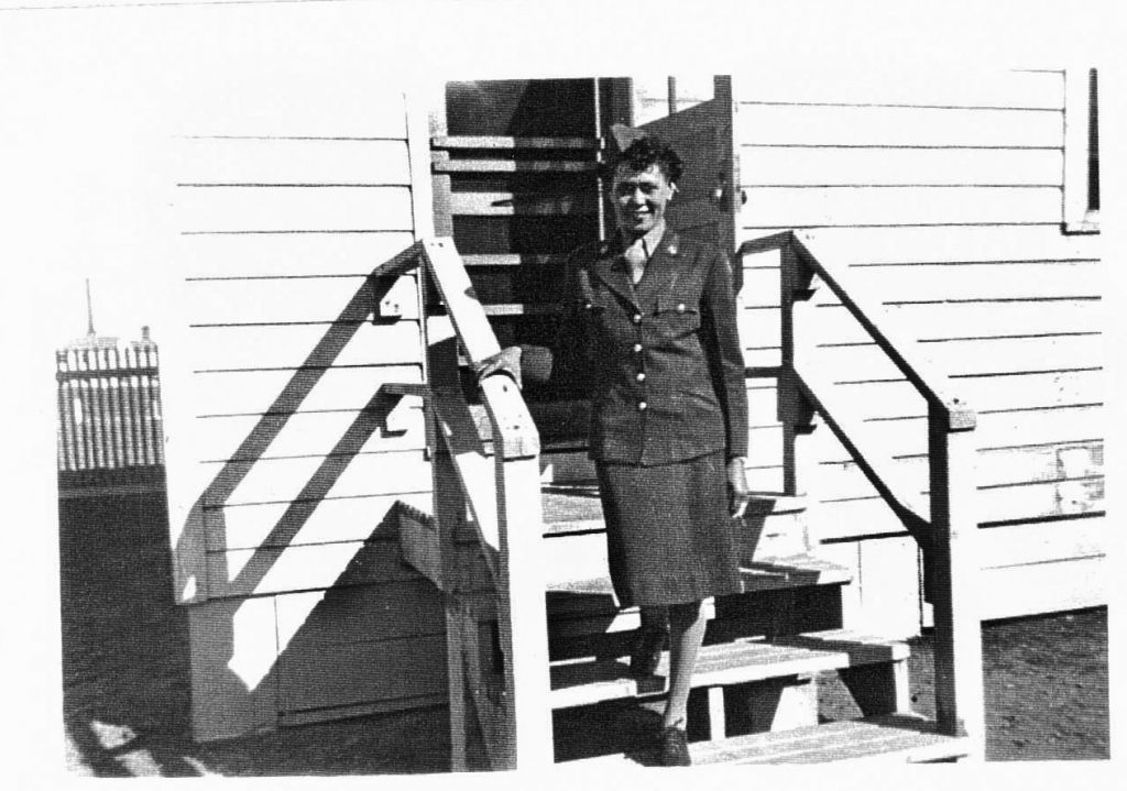 PFC Johnson stands outside her Camp Breckenridge barracks where she served before heading to Fort Oglethorpe, Georgia, for overseas training. 