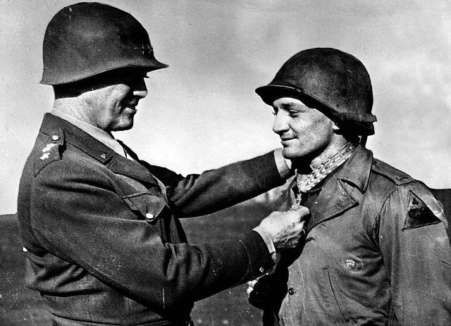 General George Patton decorates Lt. James Fields with the Medal of Honor for his bravery at Rechicourt, the first awarded to a member of Third Army in Europe. 