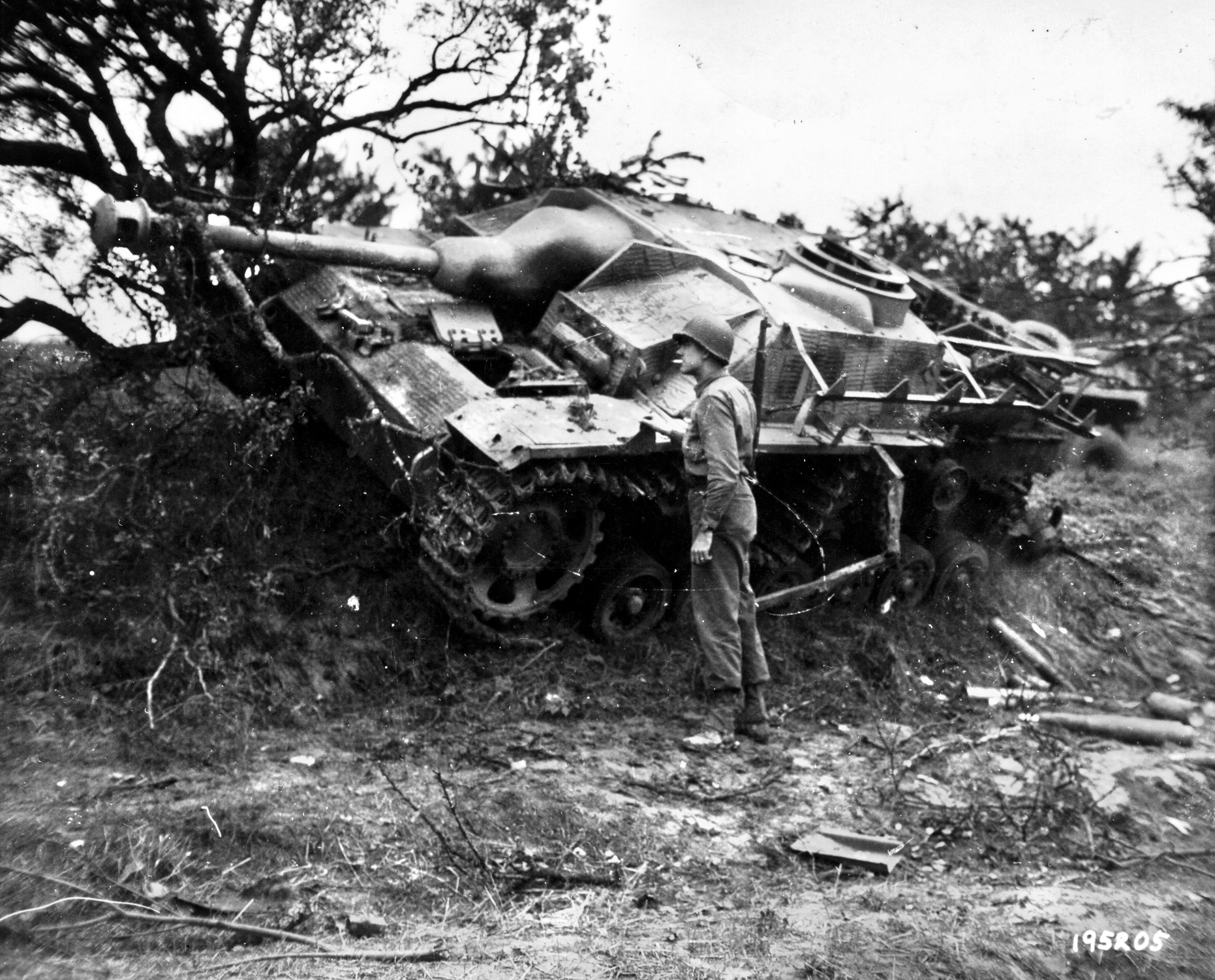 A GI examines a knocked-out Sturmgeschutz III assault gun south of Rechicourt. Such vehicles often replaced the more effective tanks in the depleted German forces in late 1944.