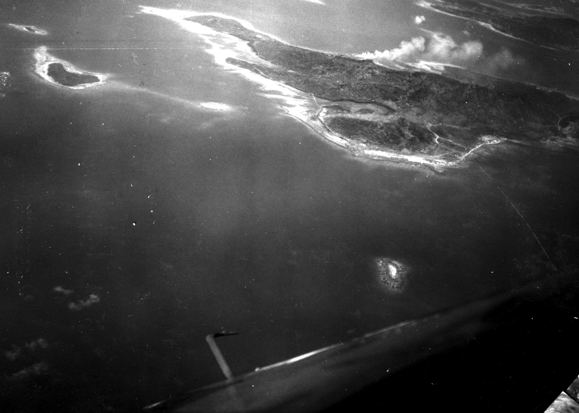Moen Island, one of many spits of land that comprise Truk Atoll, is seen in this photograph taken at the end of April 1944 by a photo reconnaissance plane of Air Group 32. The Japanese airfield on Moen is visible as the white area along the water’s edge. 