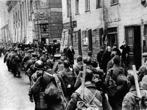 Soviet soldiers march in ragged ranks toward the defensive lines around the city of Leningrad in September 1941. Although the Germans expected Leningrad to fall quickly, the Red Army defenders and the civilian population of the great city denied the Nazis total victory. The epic 900-day siege of Leningrad followed, and the people suffered desperately until the Germans were driven back and the siege was lifted.