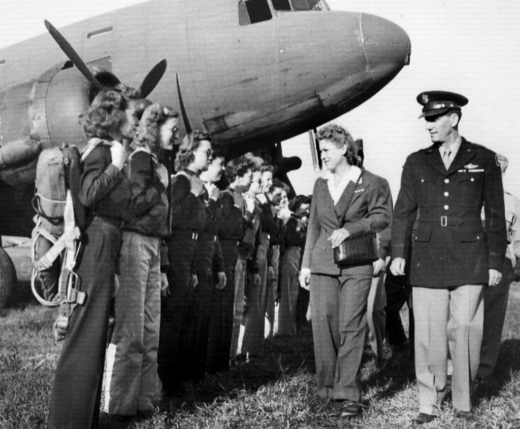 Aviation pioneer Jacqueline Cochrane inspects female cadets enlisted in the WASP (Womens Airforce Service Pilots) Program. WASP pilots became famous for their contribution to the war effort, but few were ever trained to fly high-performance aircraft. 