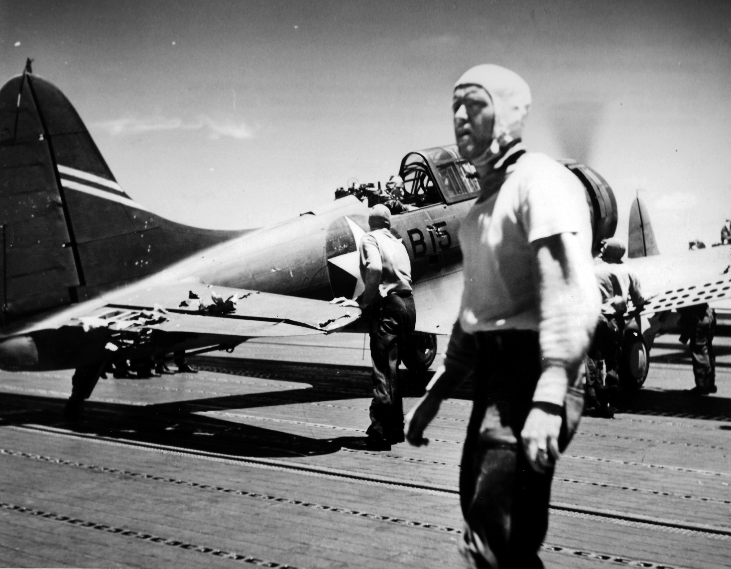 Following its attack against the Japanese aircraft carrier Kaga on June 4, a damaged Douglas SBD-3 Dauntless dive bomber rests on the flight deck of the carrier USS Yorktown. This dive bomber, one of several that landed with their fuel tanks nearly empty, belonged to Bombing Squadron 6 (VB-6) and was lost when the Yorktown was sunk later in the battle. 
