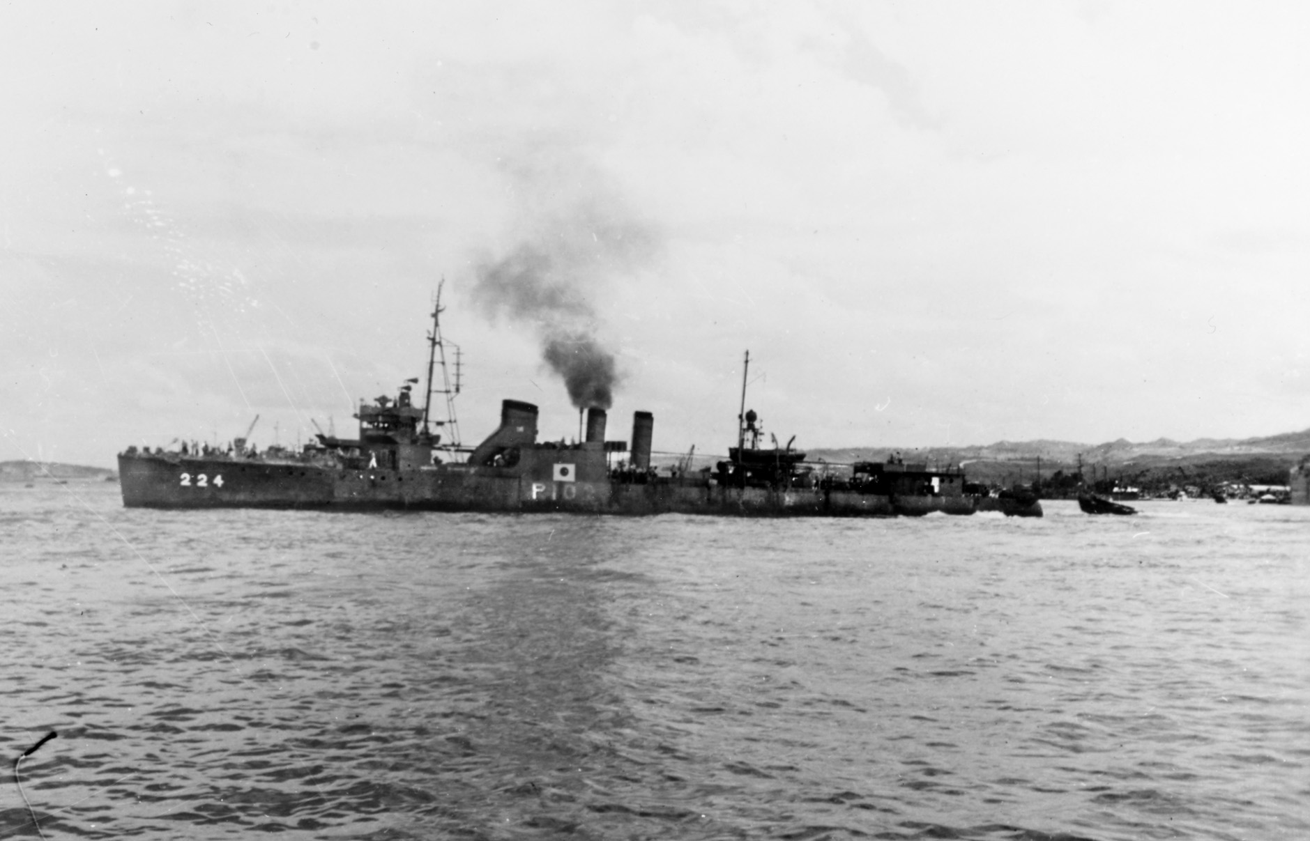 Bearing the markings of a Japanese warship, the Stewart lies in the harbor of Hiro Wan, Japan, on October 29, 1945. This photograph was taken after the destroyer was returned to the U.S. Navy; however, the Japanese flag and her designation as patrol boat P102 are visible amidships.  