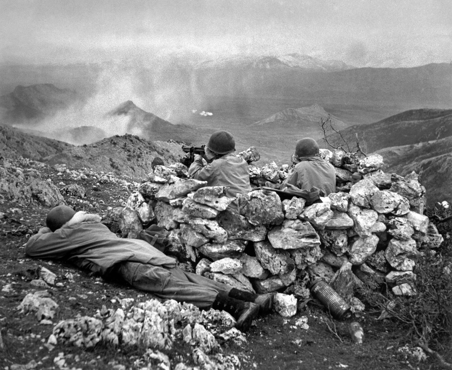 The 1st Special Service Force scaled the heights of Monte La Difensa and subdued the German defenders in a difficult operation in early December 1943. In this photo taken a few weeks later, soldiers of the Force occupy a mountaintop position near the embattled town of Cassino, Italy.