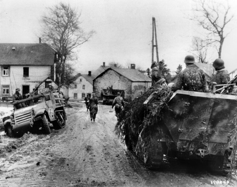 German soldiers enter a French village during the opening hours of the Ardennes Offensive of December 1944. Intelligence reports of a German buildup of men and materiel were virtually ignored by senior American commanders in the days leading up to the offensive.