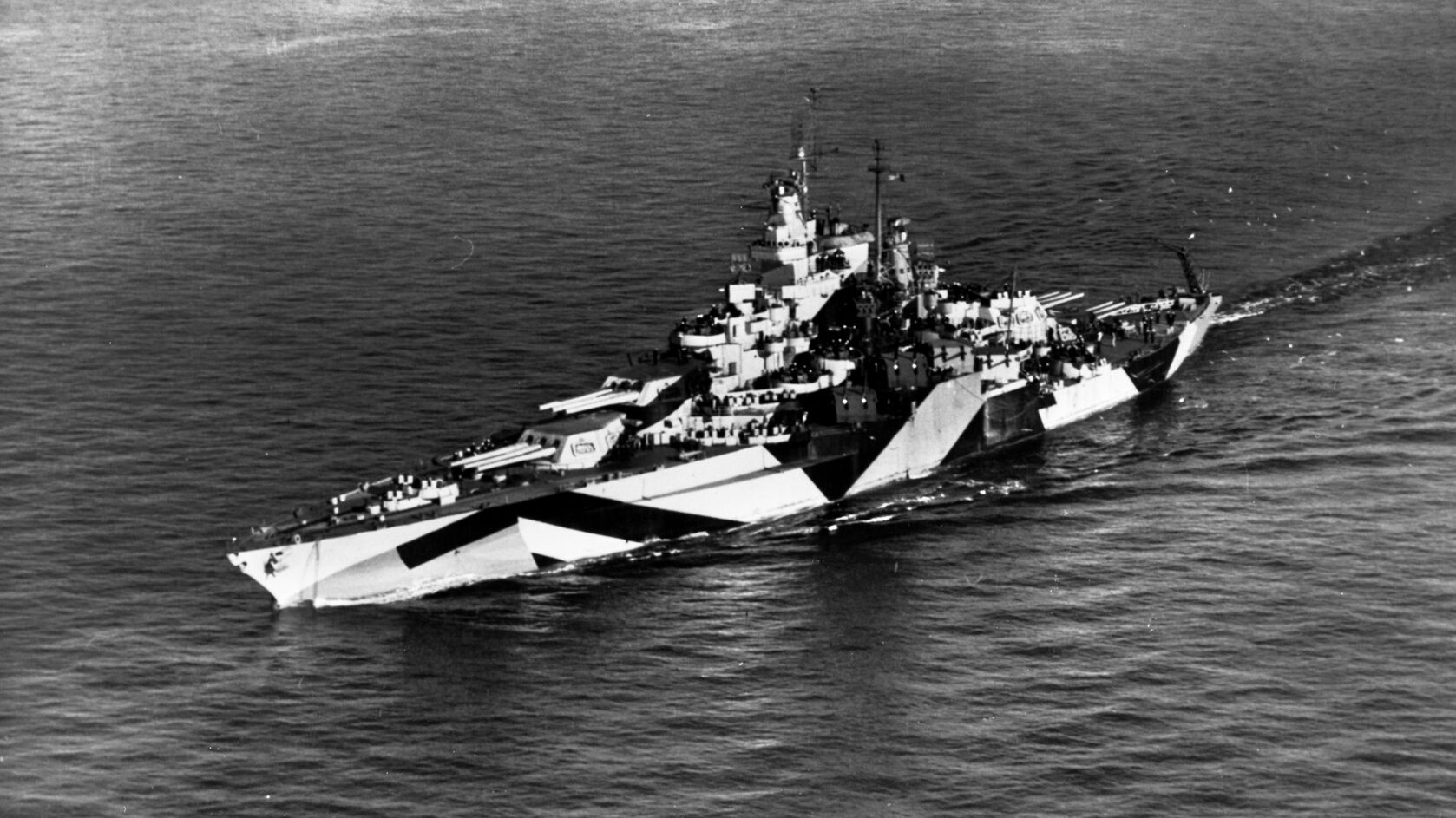 Painted in camouflage pattern Measure 32, Design 16-D, the repaired and modernized California steams at eight knots off the coast of Washington state on January 25, 1944. After returning to service, the battleship bombarded Japanese positions on several Pacific islands in support of amphibious landings.