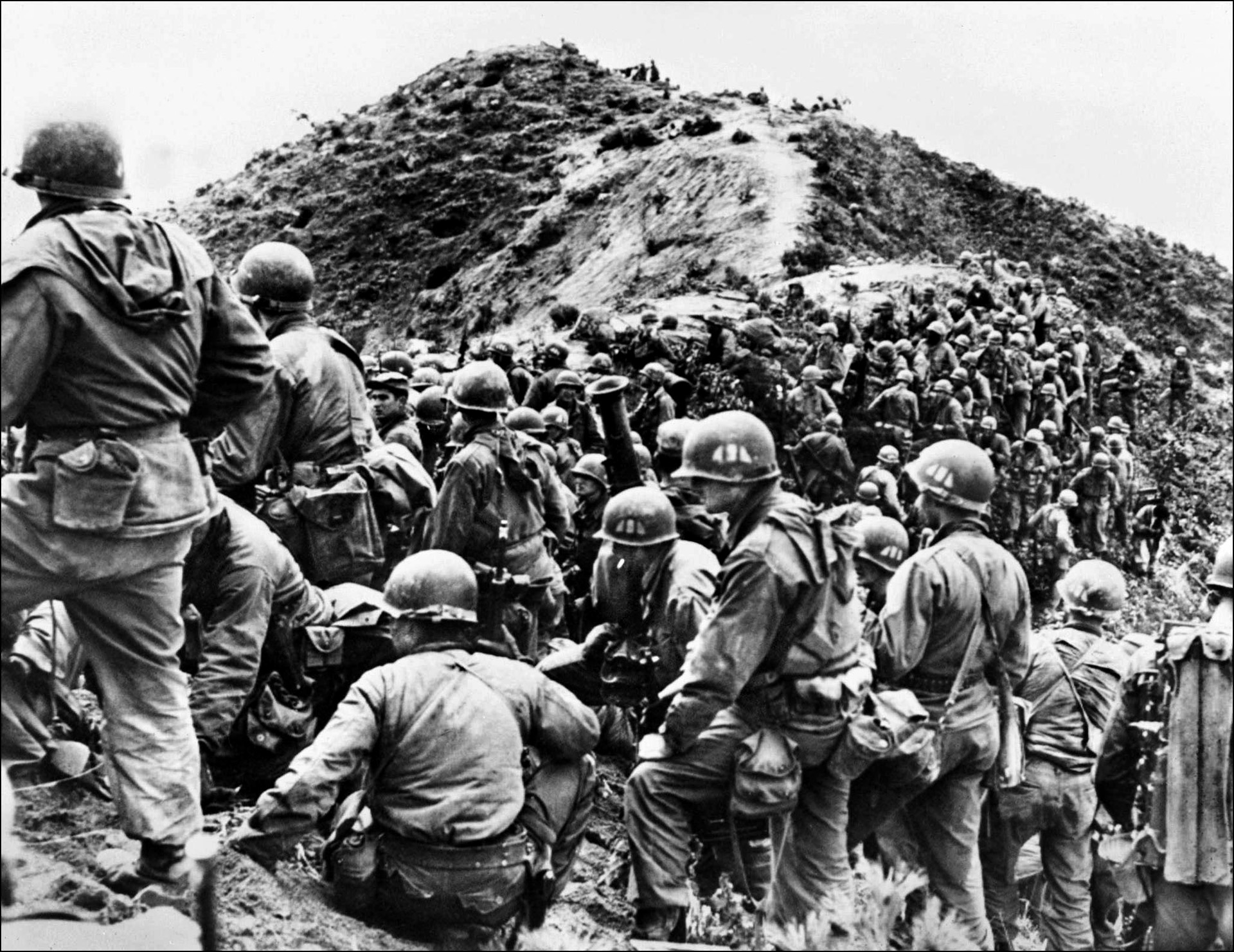 Troops of the U.S. Army's 187th Regimental Combat Team prepare to assault a ridge held by the Chinese in May 1951. By summer 1951 the war had become a stalemate with each side launching new offensives only to influence peace negotiations.