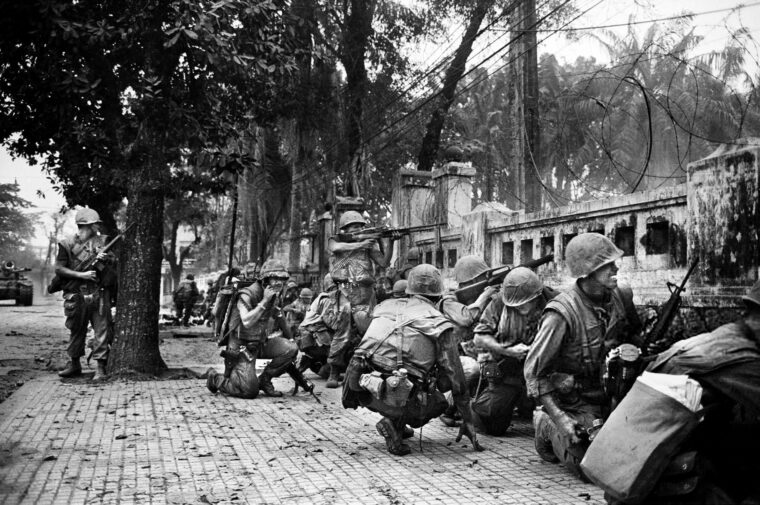 U.S. Marines endure heavy fire from North Vietnamese in well-concealed positions in Hue's 19th-century citadel.