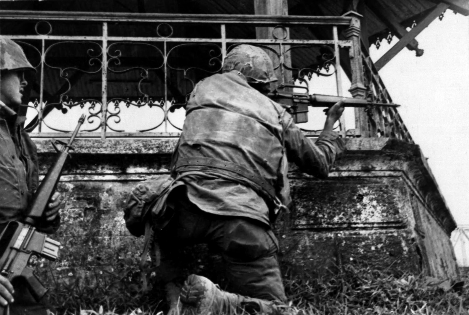 A Marine on the south bank of the Perfume River fires towards the citadel on the north bank. After securing the MACV compound, Canley and his fellow Marines had to pry heavily armed North Vietnamese soldiers from buildings in the residential sector.  