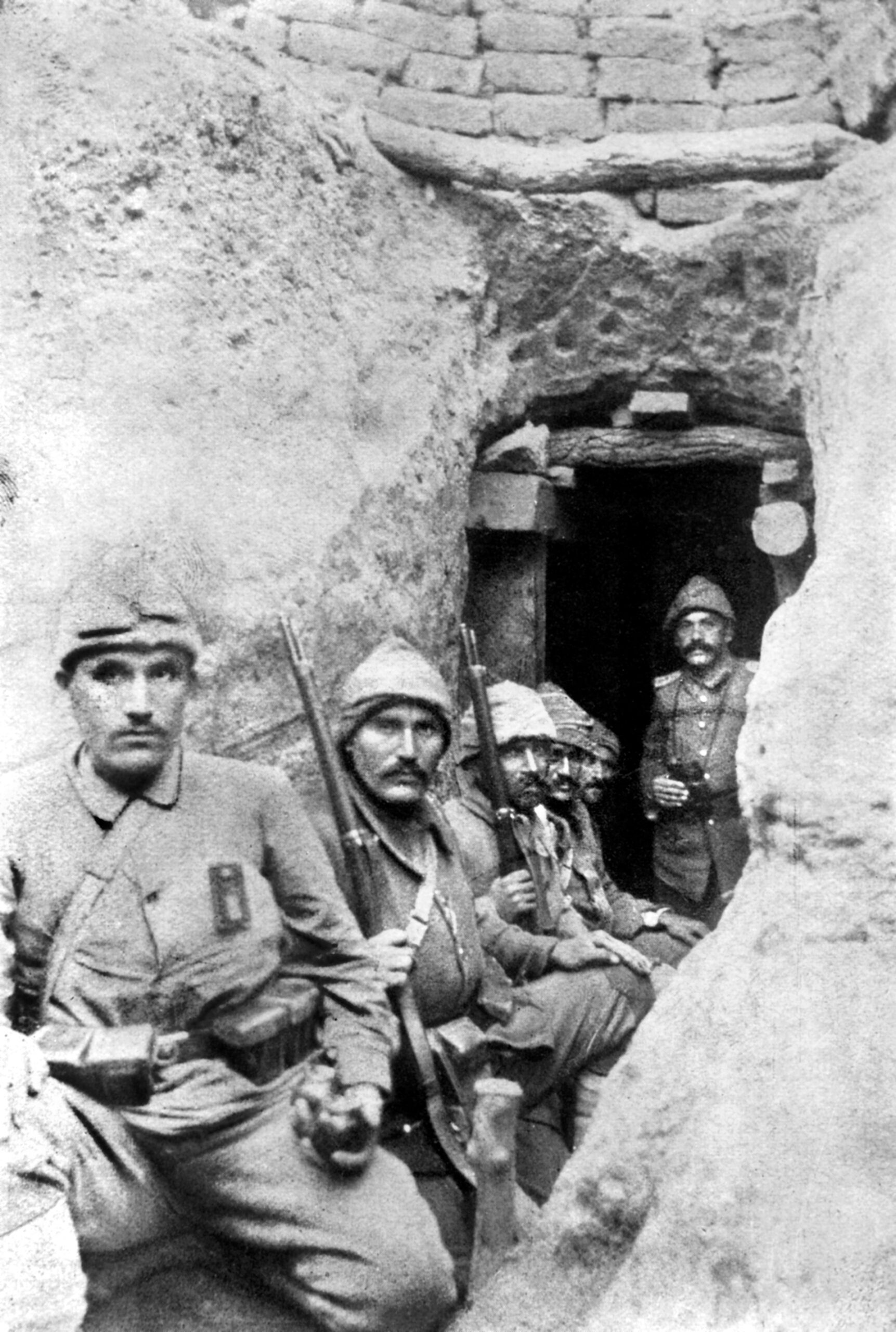 Turkish soldiers armed with German-made Mauser rifles are seated in a trench next to one of the thousands of dugouts on the peninsula used for protection against incoming artillery shells. Ottoman General Mustafa Kemal Pasha’s inspired leadership played a key role in the Ottoman victory.