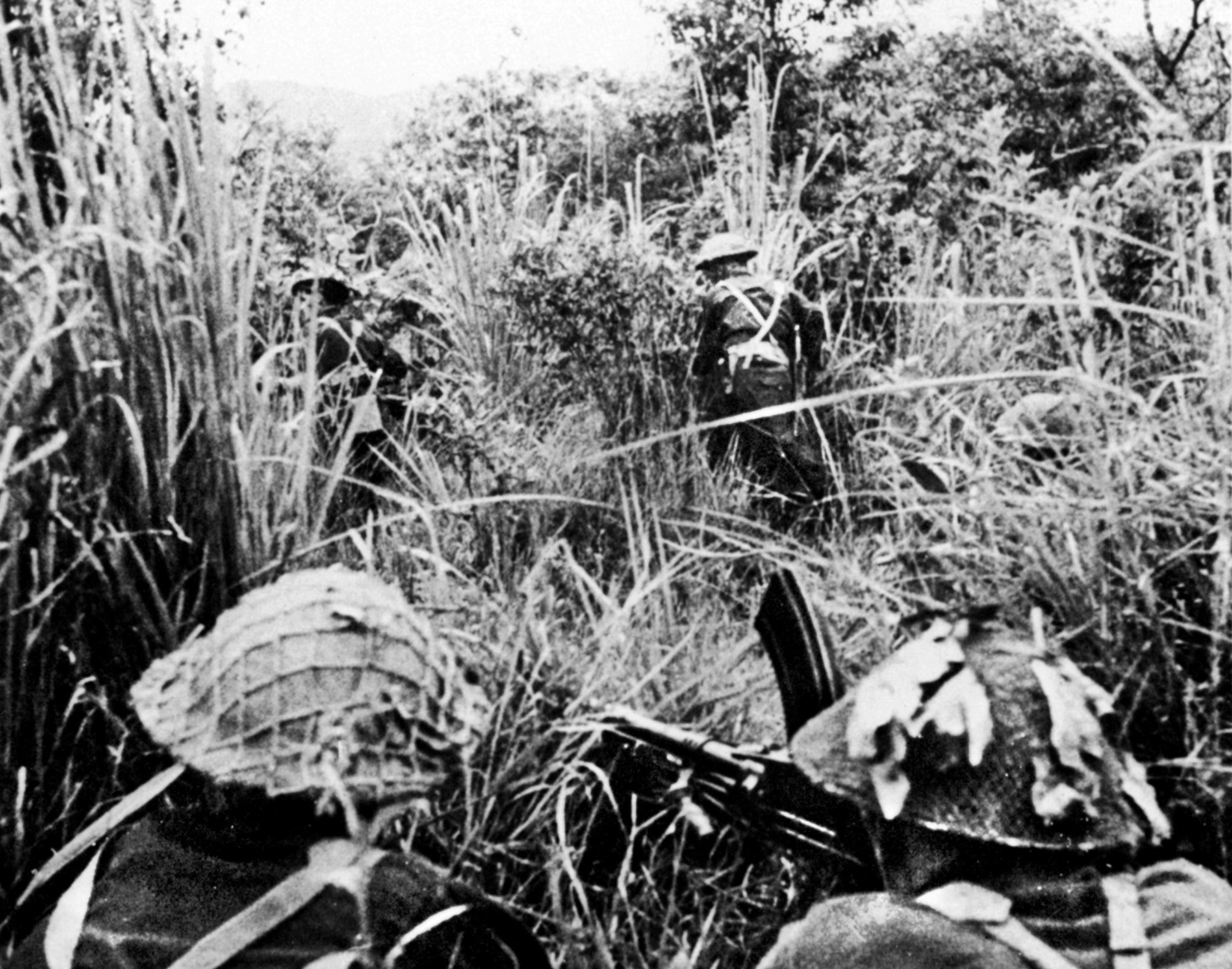A British Bren gun covers the advance of a patrol through tall grass and thick undergrowth during the actions at Kohima and Imphal the spring of 1944. By then, the tide had turned in favor of the Allies in the CBI.