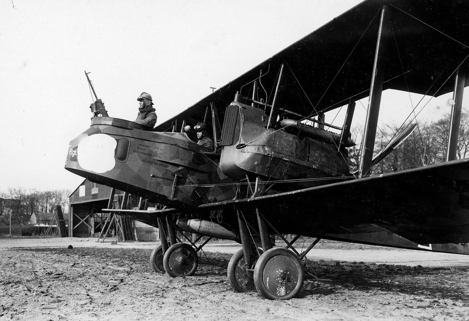 A machine gunner mans the nose gun of a Gotha heavy bomber. The air crews wore fur-lined flight suits to keep them warm at high altitudes in the aircraft's open cockpits.