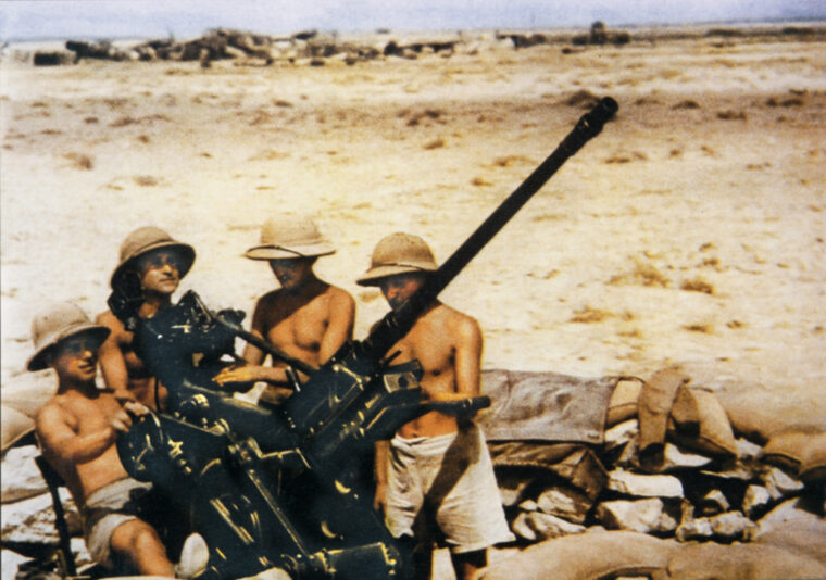 An Afrika Korps antiaircraft gun crew scans the sky for enemy planes in 1941. Homeland antiaircraft units were also raised in Germany to augment the air defenses against massive Allied bombing raids.