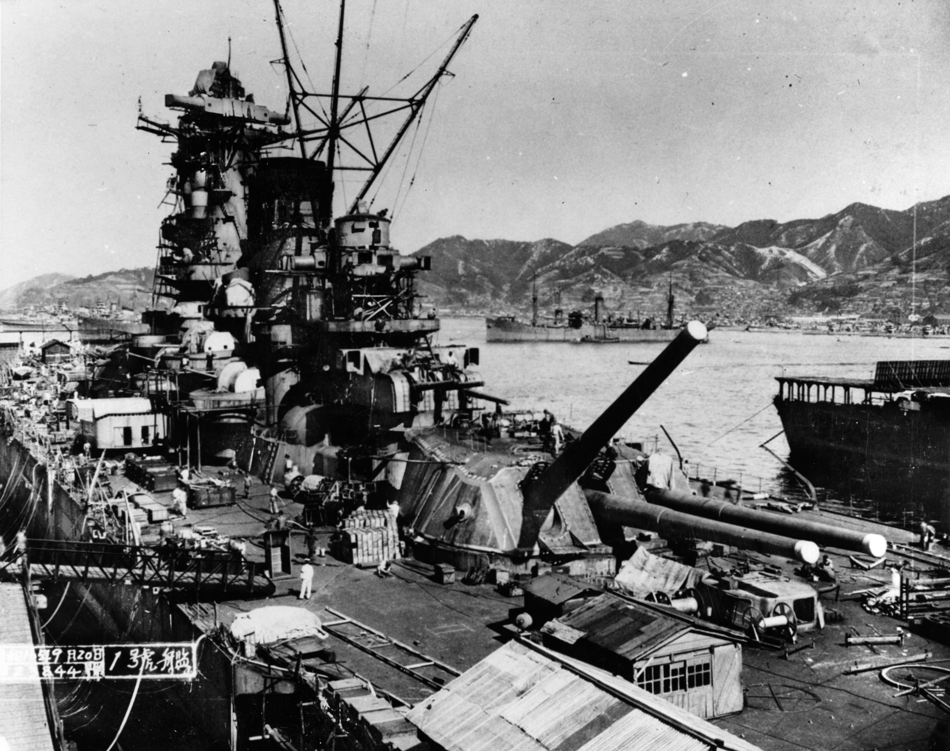 The Yamato, which is shown in the final phase of construction at Kure Naval Base, boasted nine 18-inch main guns that could hurl 3,200-pound shells as far as 25 miles. 