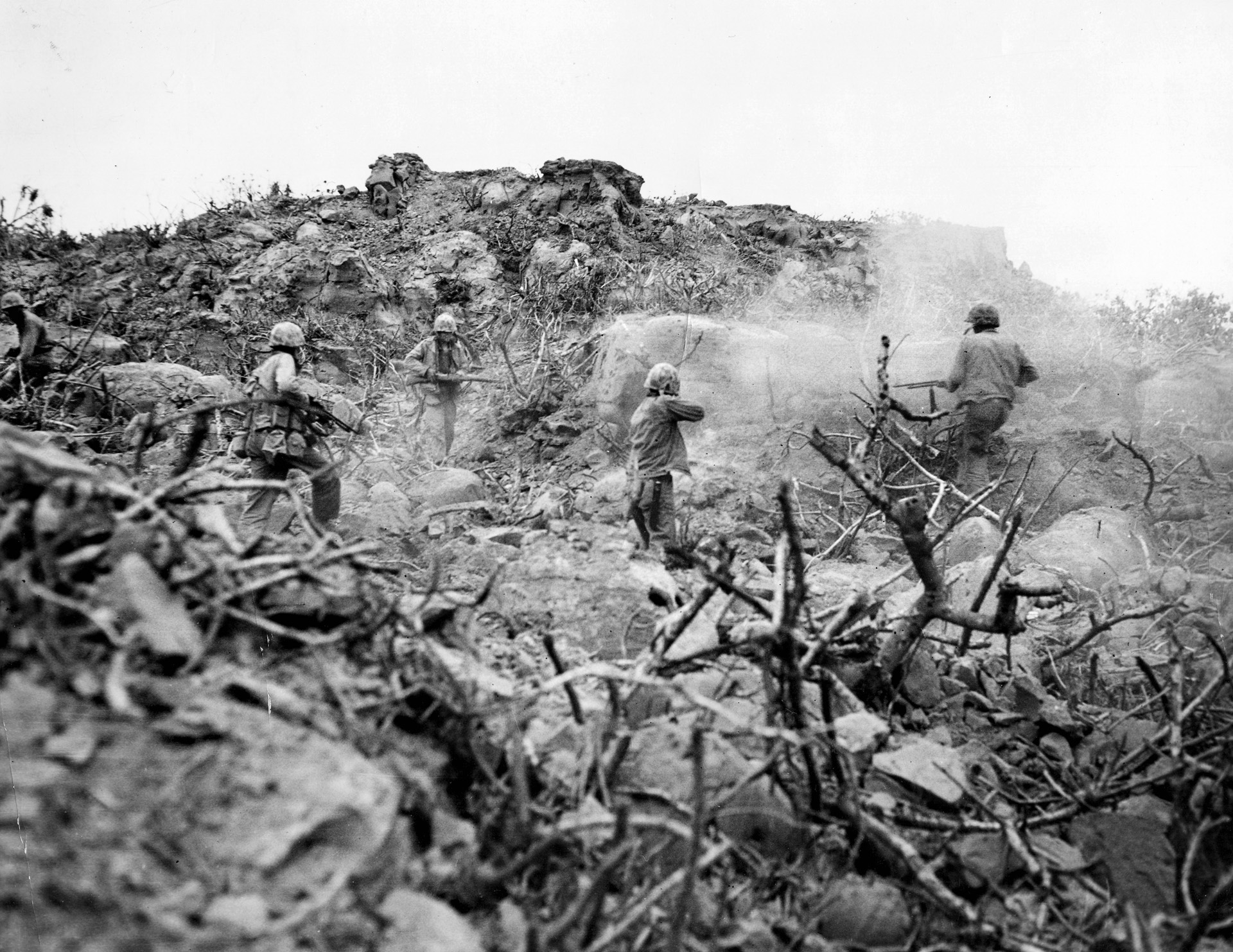 Marines assault an enemy-held cave with grenades, Browning Automatic Rifles, and M1 carbines. The Japanese clung to their defensive positions with astonishing determination. 
