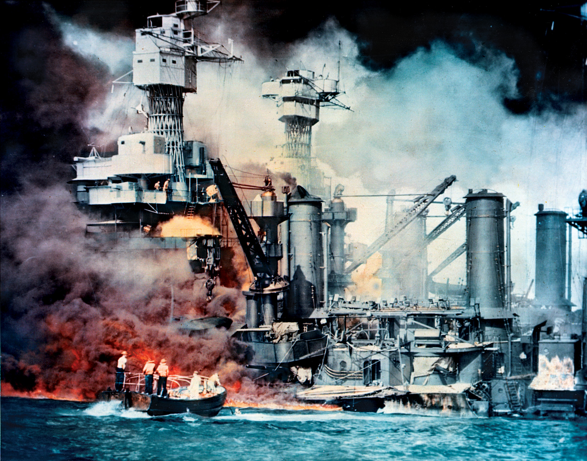 Smoke and flames billow from the stricken battleship USS West Virginia in Pearl Harbor on December 7, 1941.