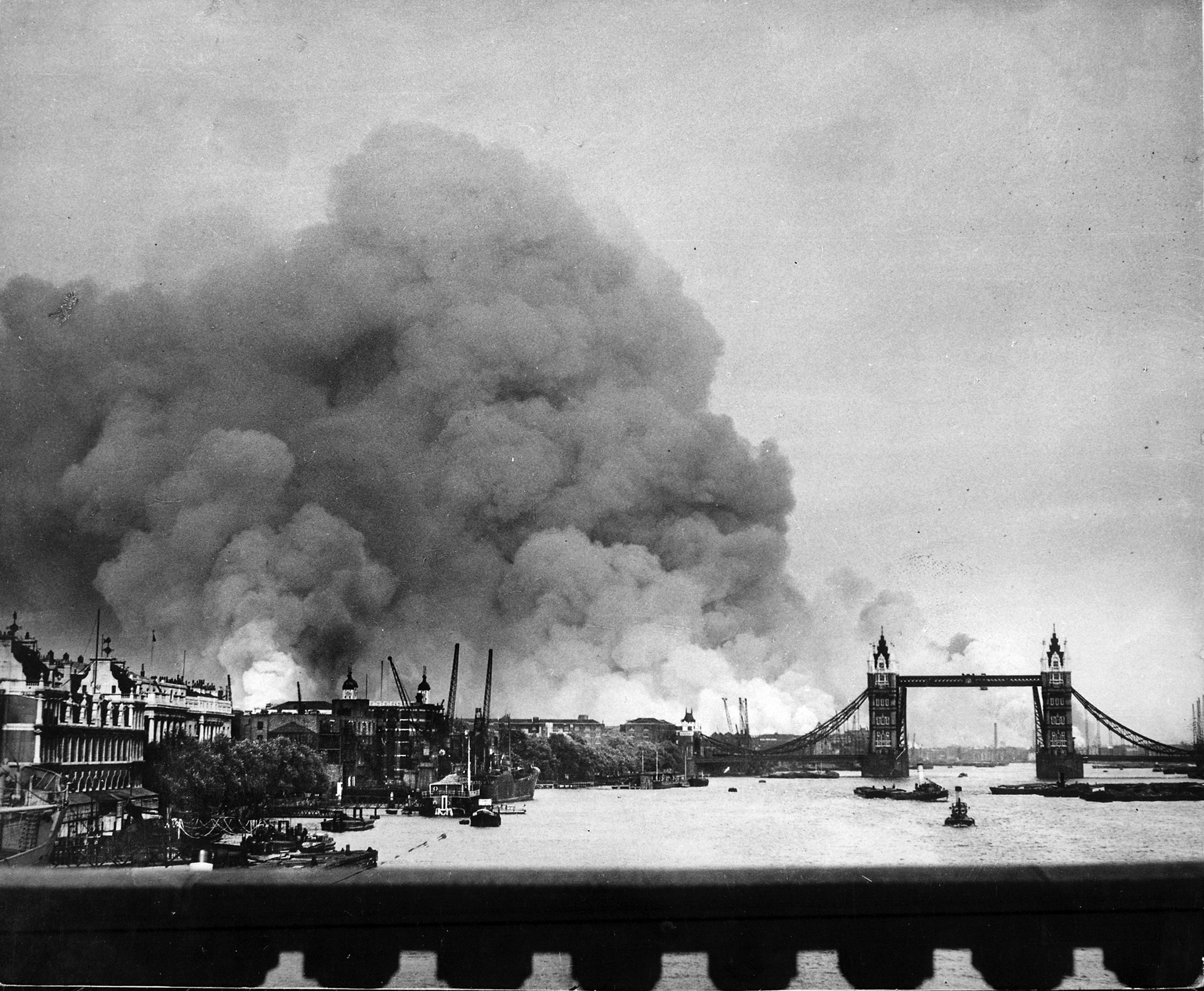 London, especially the East End, took a severe pounding from multiple Luftwaffe raids during the Blitz. Here, smoke rises above the Surrey Docks after a bombing raid on September 7, 1940—the first day of the Blitz. Tower Bridge is visible at right.